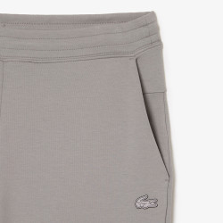 Pantalon de survêtement Lacoste slim fit en double-face Chez DM'Sports